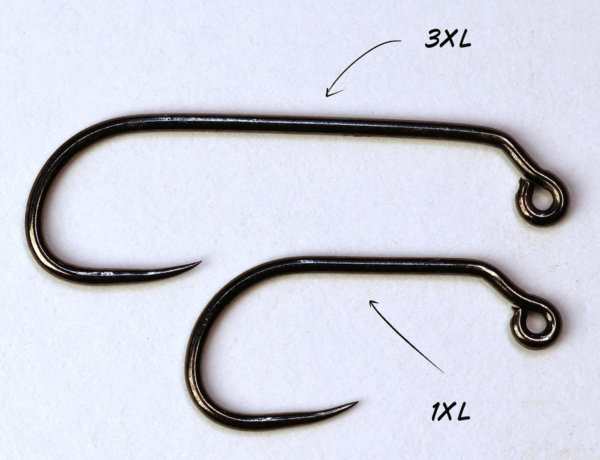 Two barbless jig hooks, labelled 1XL and 3XL, showing the longer shank on the 3XL hook